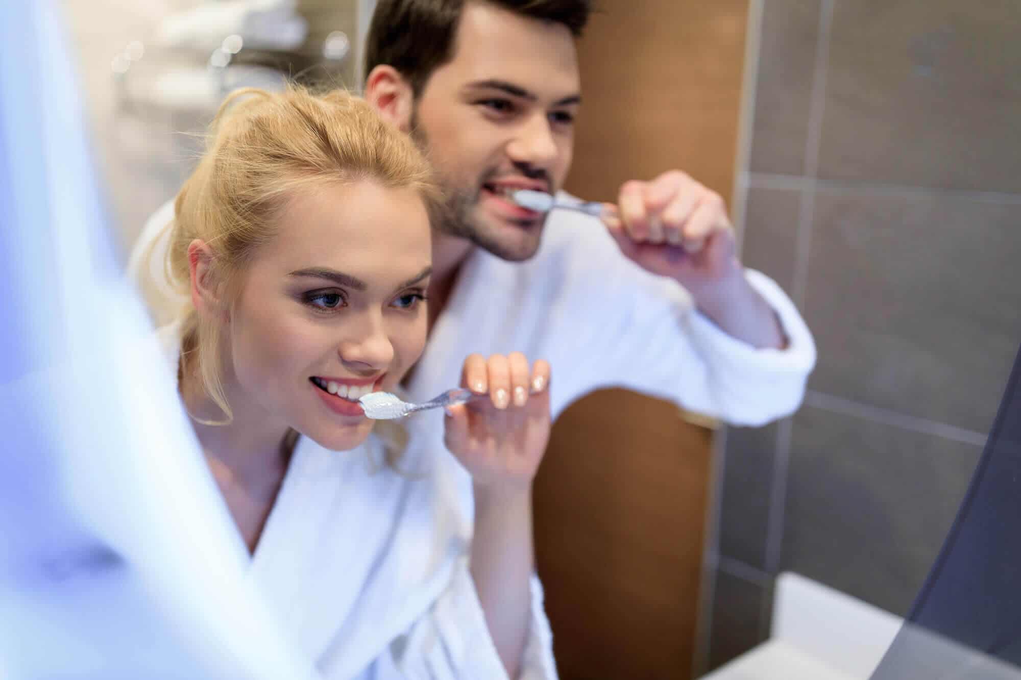 brushing your teeth in the kitchen sink